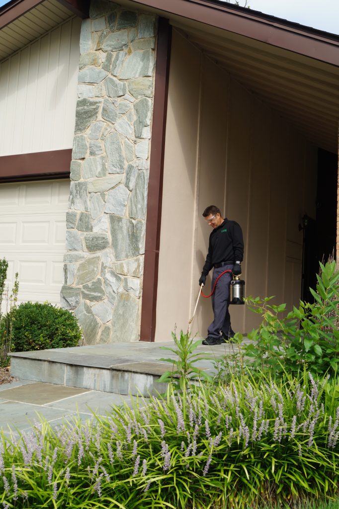 Jack Rossi of Rossi Pest Services treating a home in Northern Virgina